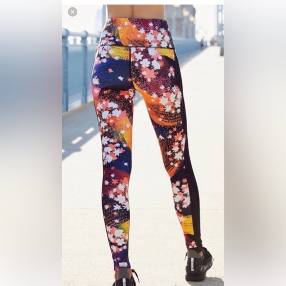 Free People movement Liza Illusion Floral Leggings Cosmic Orange medium FP